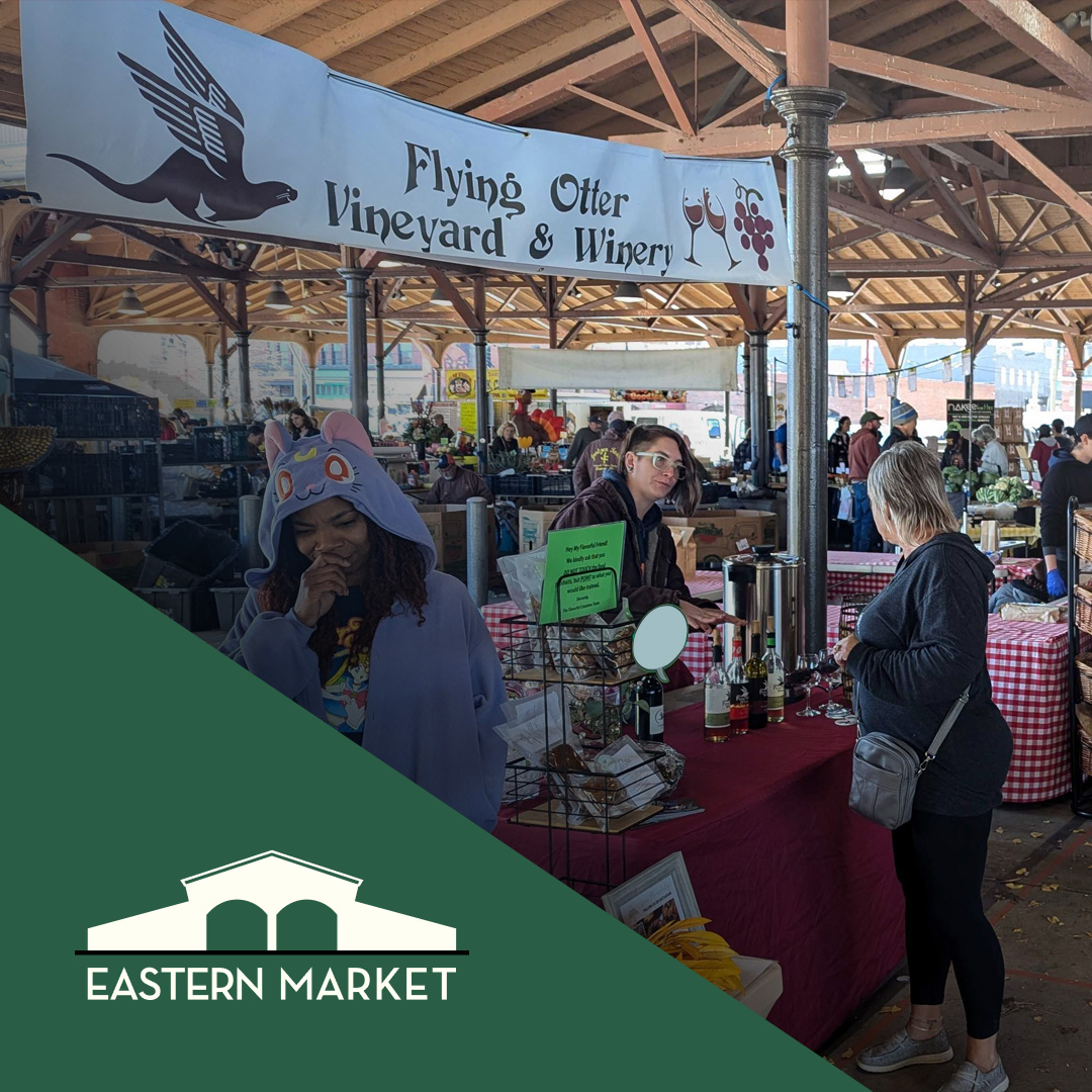 Image of Flying Otter Winery staff selling wines and ciders at Eastern Market.